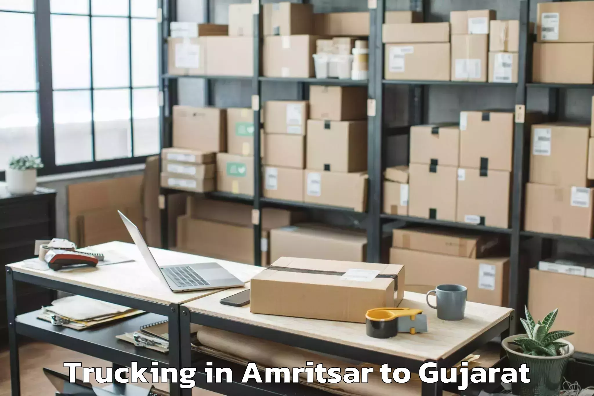 Book Amritsar to Lavad Trucking Online